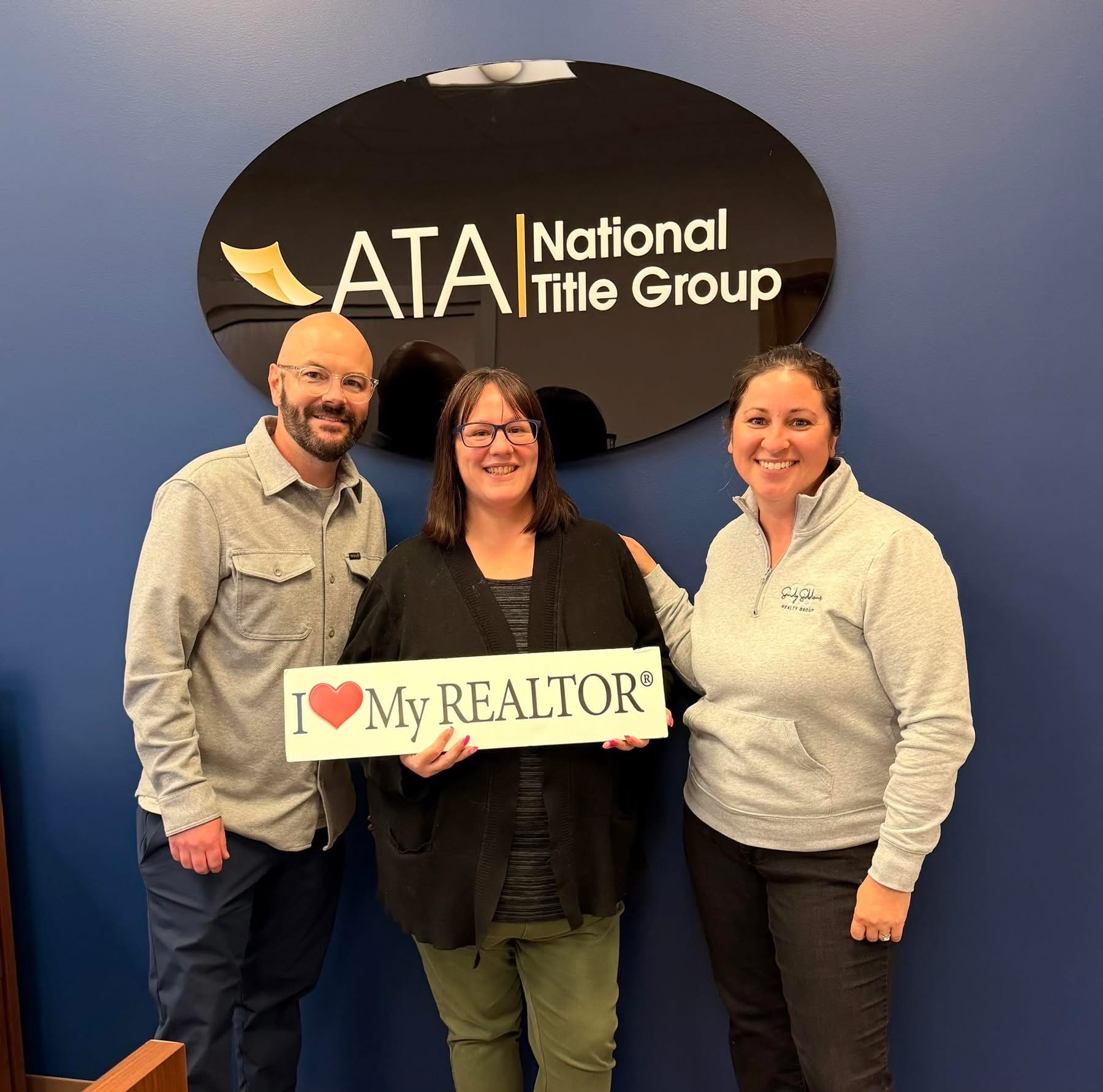 Sandy Siddons with clients at closing